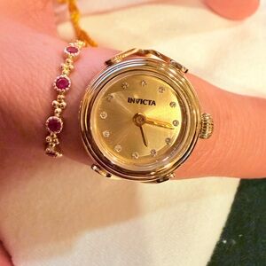 Invicta Women’s Gold Crystal Accent Round Dial Ring Watch